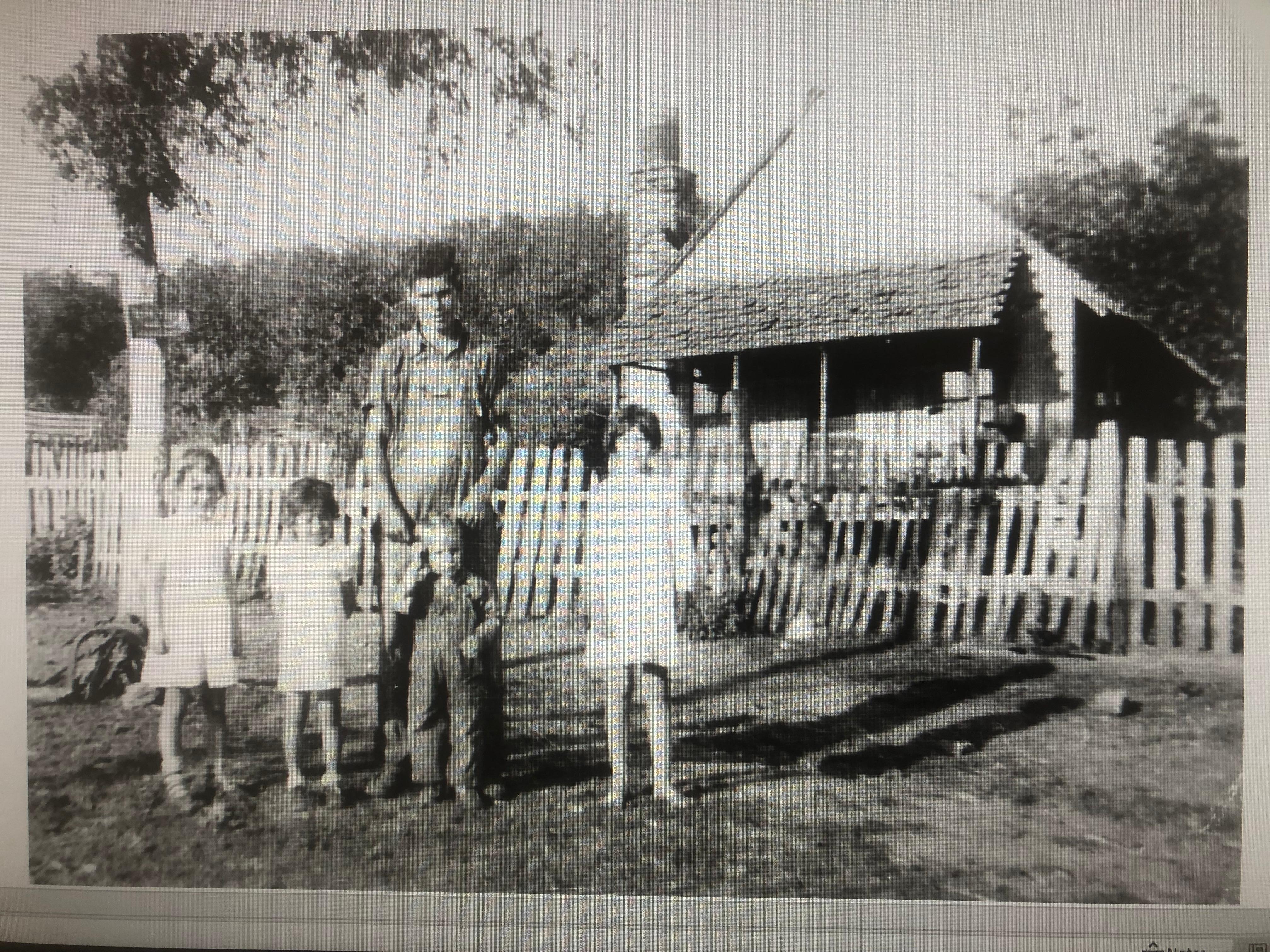 Aunt Lavern on the right with brothers Ernest and Joe and nieces Mickey and Anita in front of the house where Lavern and Joe were born.