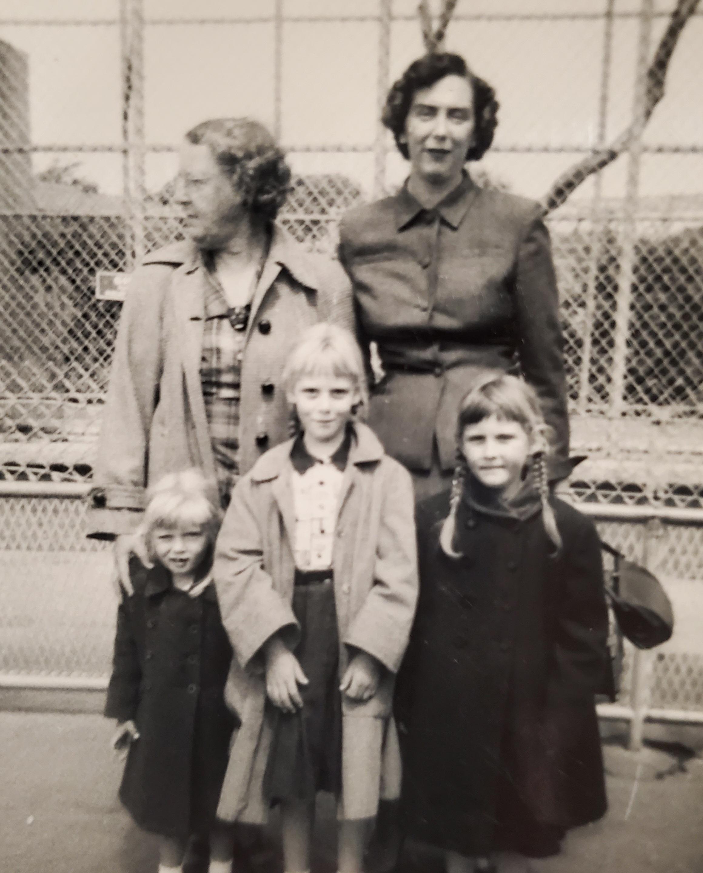 3 generations of Eklund women- Grandma Jean Eklund (our paternal grandmother) top left, probably looking to escape us (ha!), Ame Eklund our mother top right, and front row left to right are Lora, Sandy and Carole. 