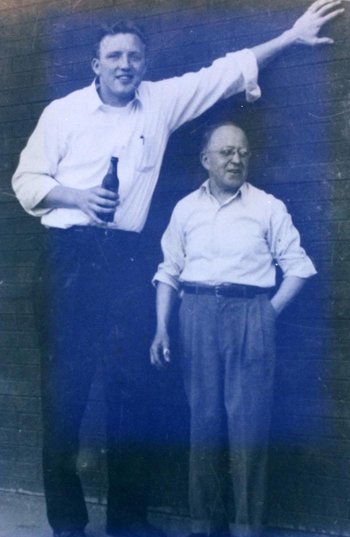 Lyman took a photo with his boss to show how tall he was in comparison.