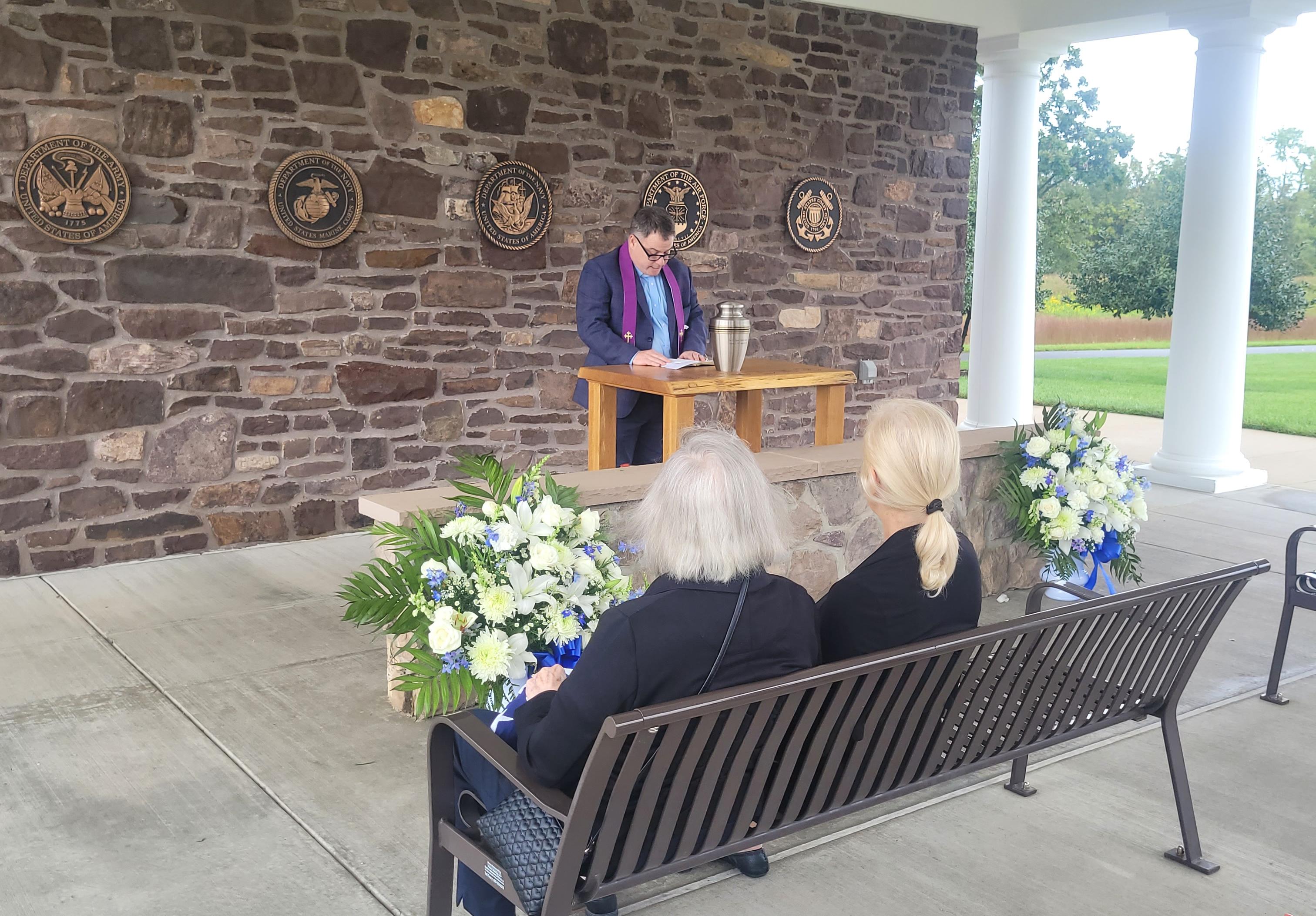 Grace and Karla listening to Rev. Dan Andrews speak at Lyman's interment at Washington Crossing National Cemetery