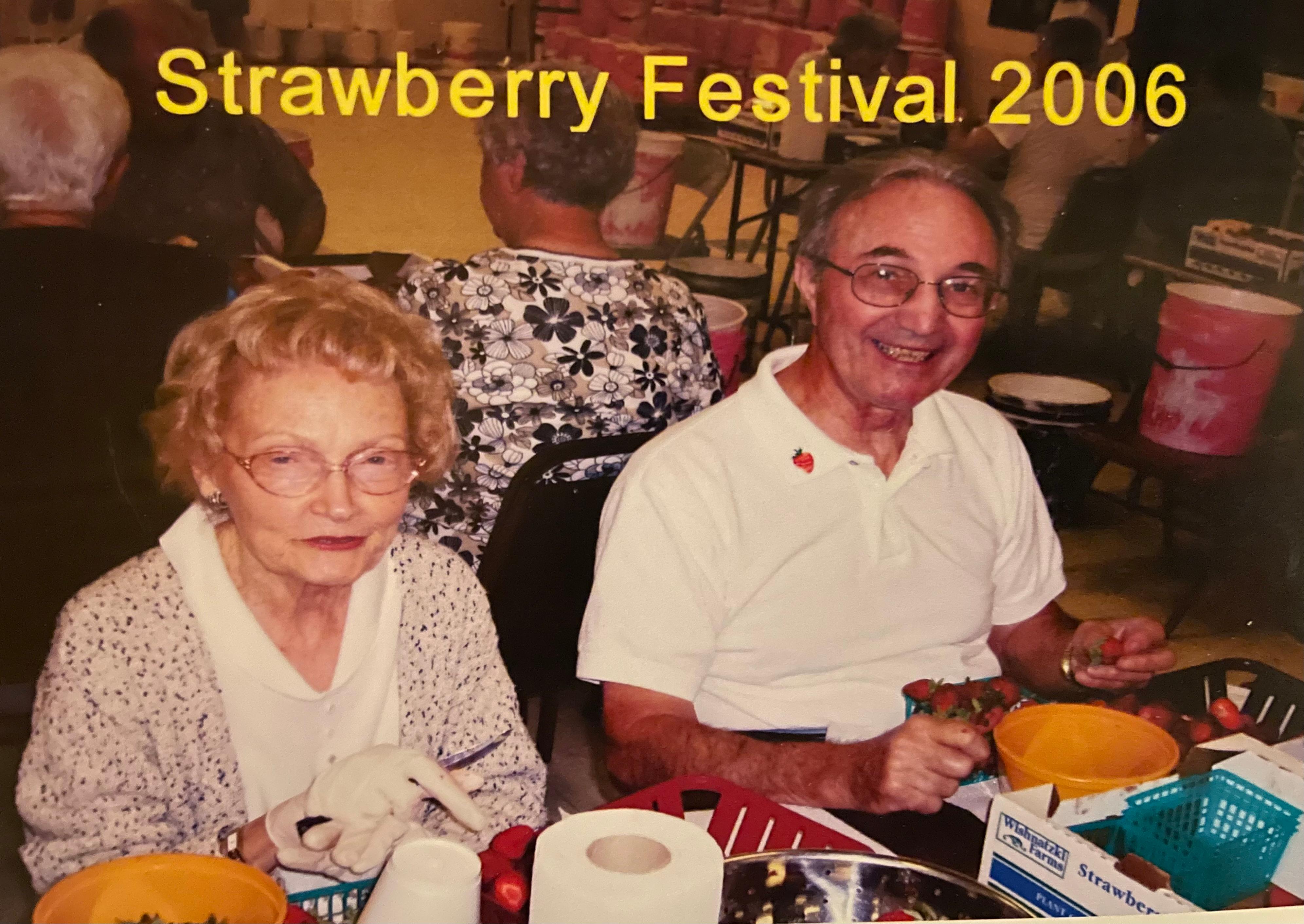 Cleaning strawberries for the annual festival.