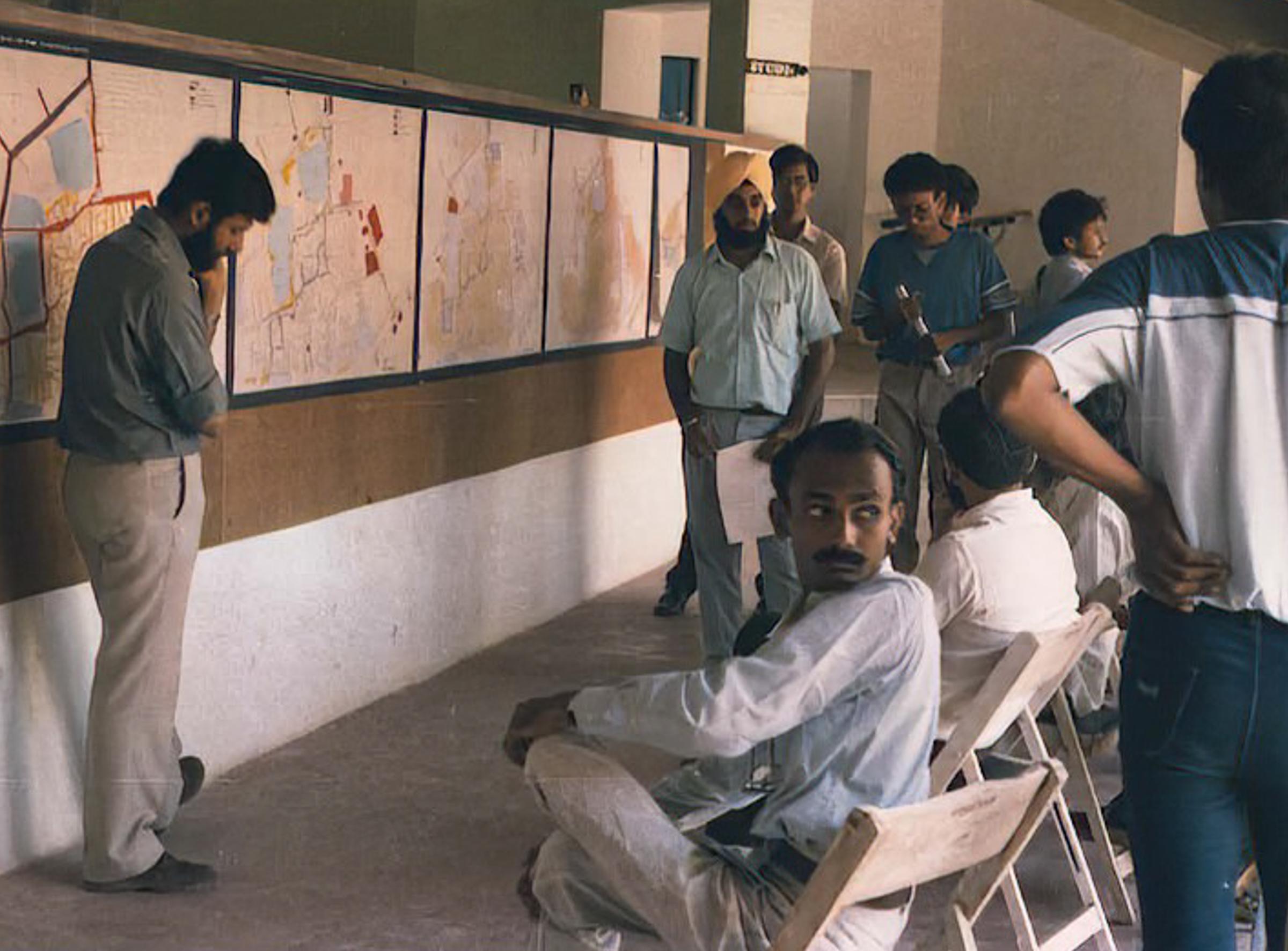 About 1987 at the School of Architecture, VV Nagar, during a Jury Presentation.
L to R: Haresh V (presenting), Arvinder, (late) Anand Pantogee, Percy M, Sudhanshu T, Prof Vinay Shah, Prof Kalol Joshi (seated).