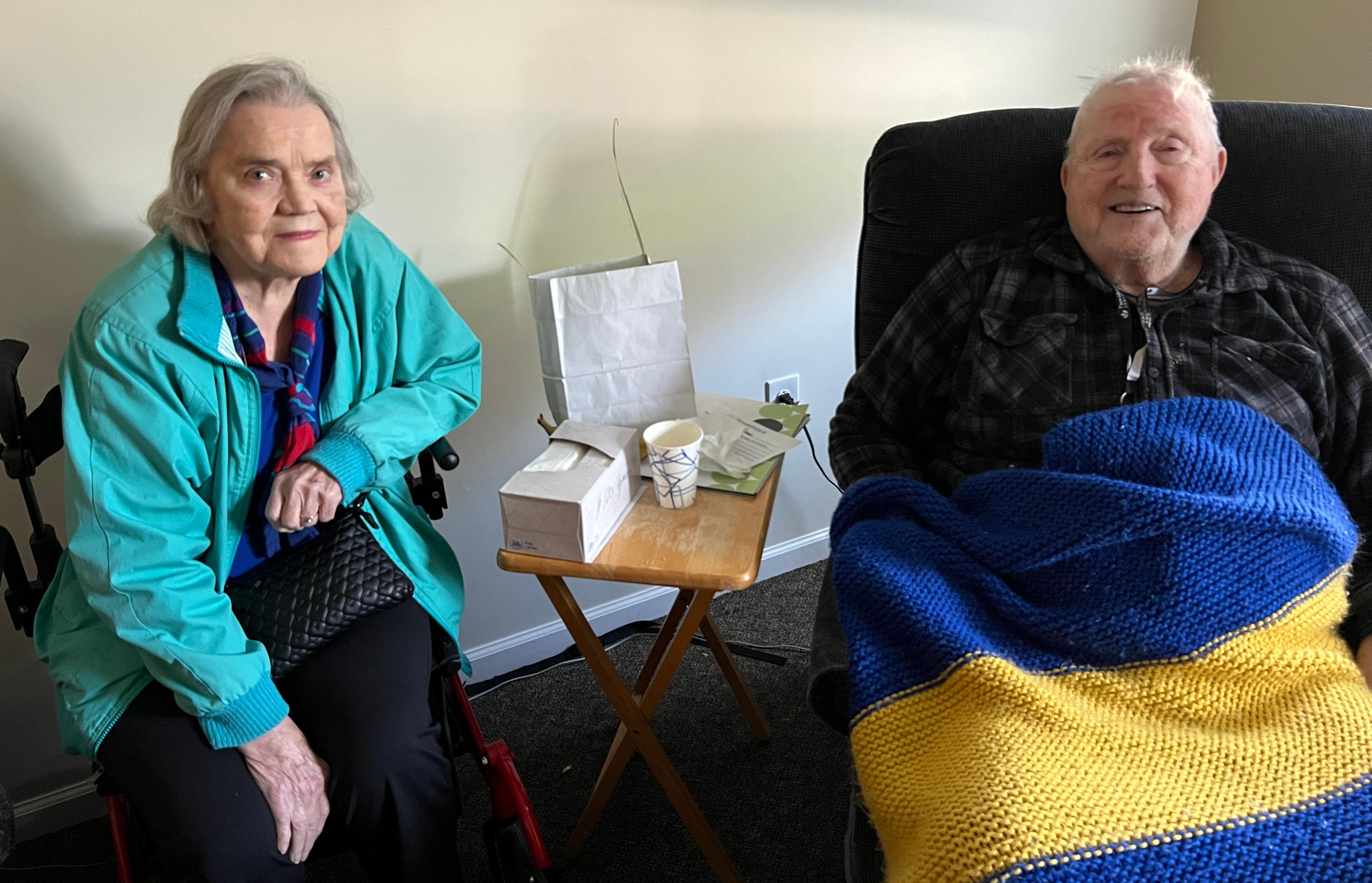 Grace with Lyman and his favorite Swedish flag colors blanket that Devon knitted for him.