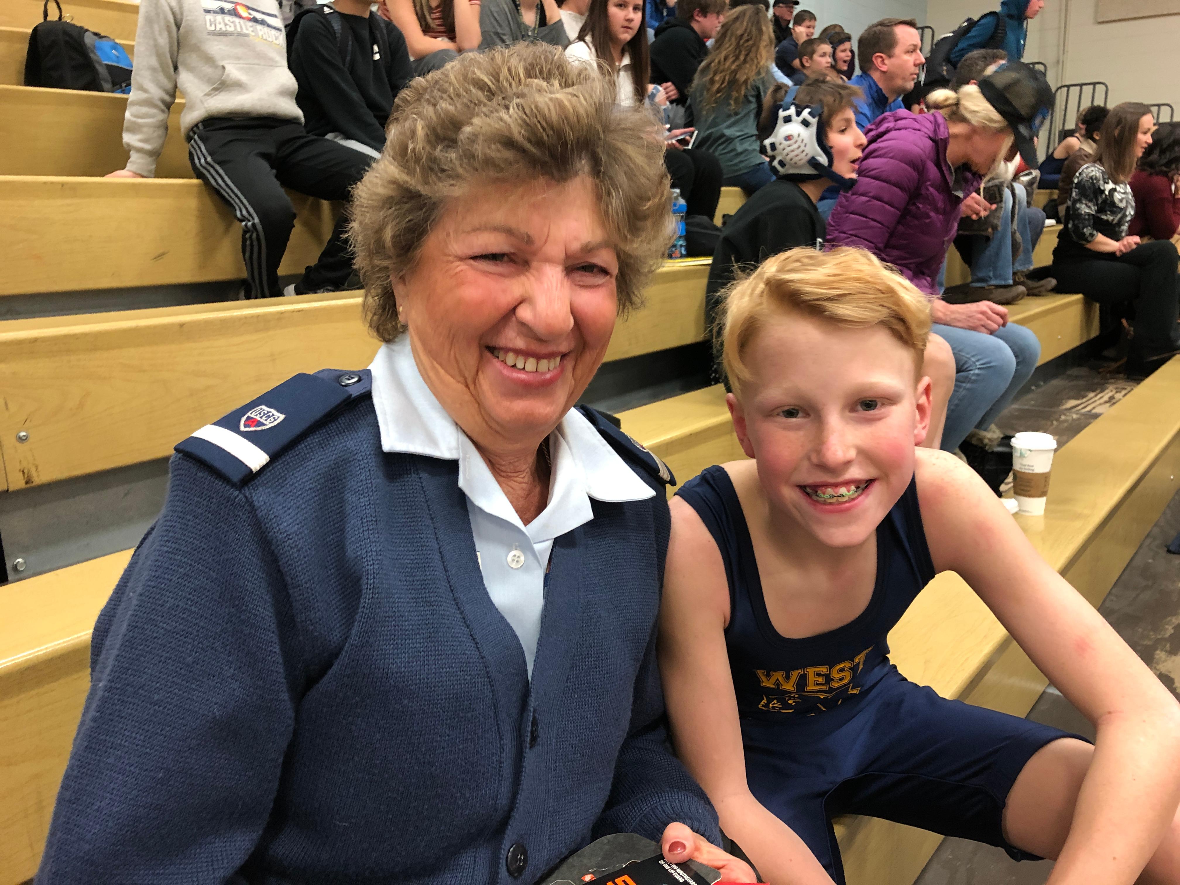 Ellie cheering Brady on at a wrestling match (straight from a Coast Guard Auxiliary event). 2020