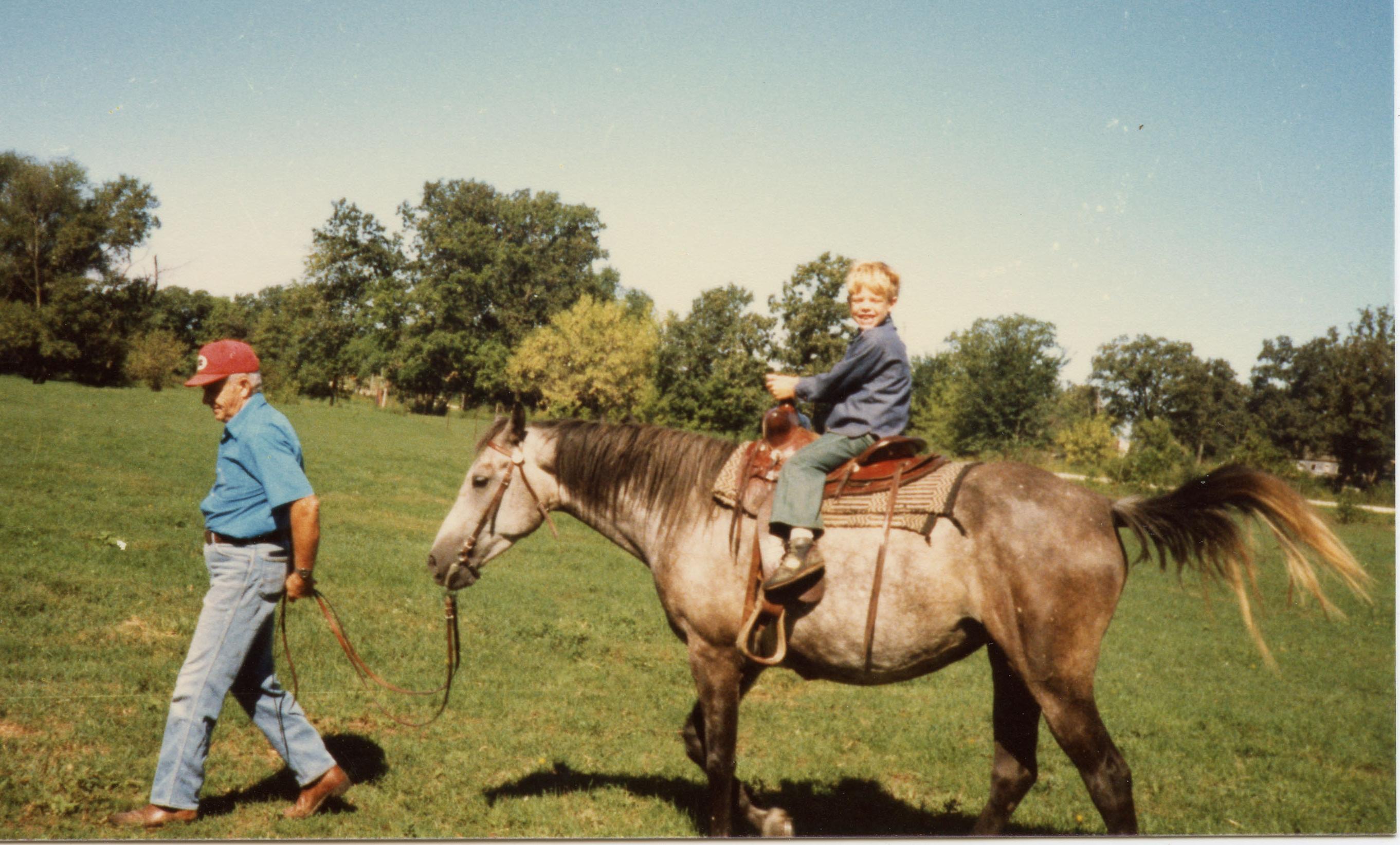 Jesse on Smokey, Grandpa Michels leading the way.