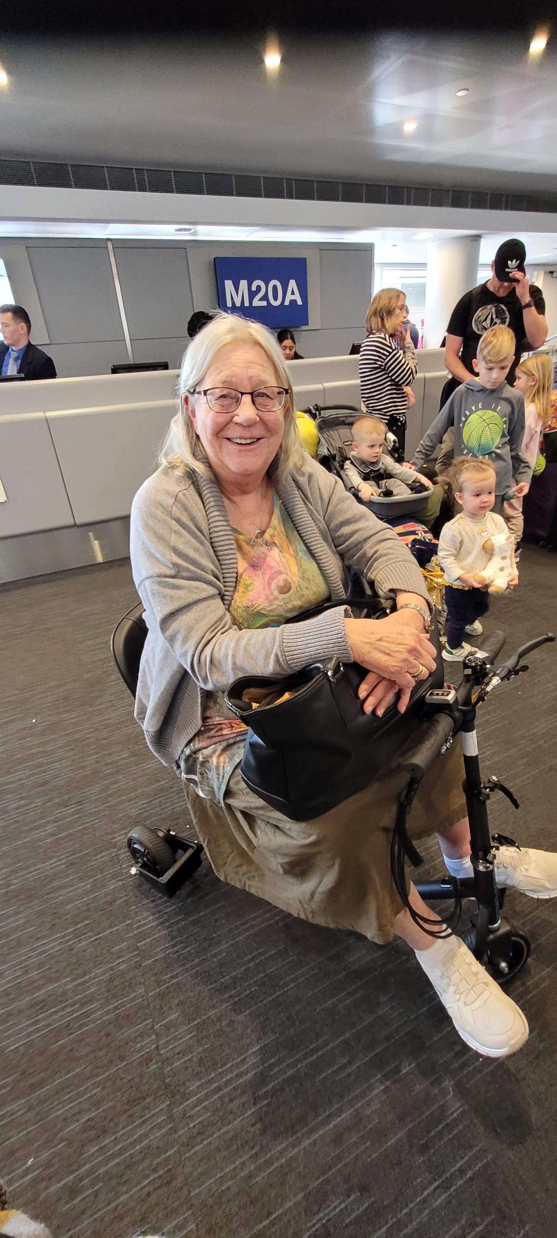 Mom on her amazing scooter at the infamous O'Hare Airport! She used that thing to get around the very long walks in the airport. She was so stubborn about getting it at first, but when she was on it, she loved the freedom she had regained. Her lower back made it so that she couldn't walk, but she didn't let that stop her. 