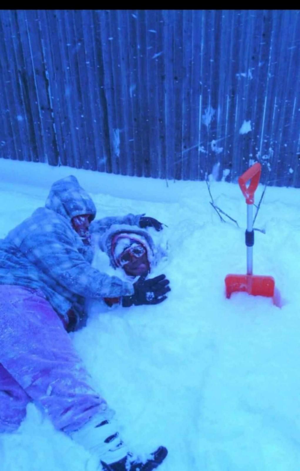 David being buried in snow by best friend Paige Martin!