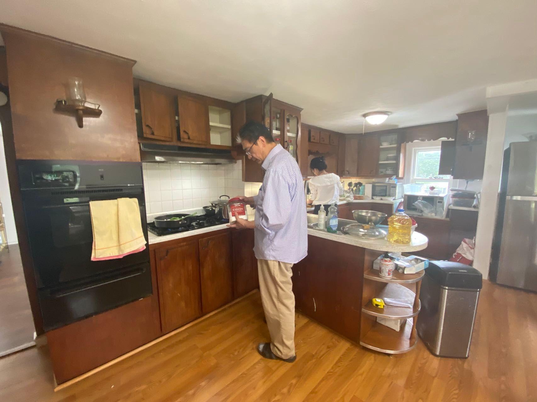 Pastor preparing food at the New Church House in Troy