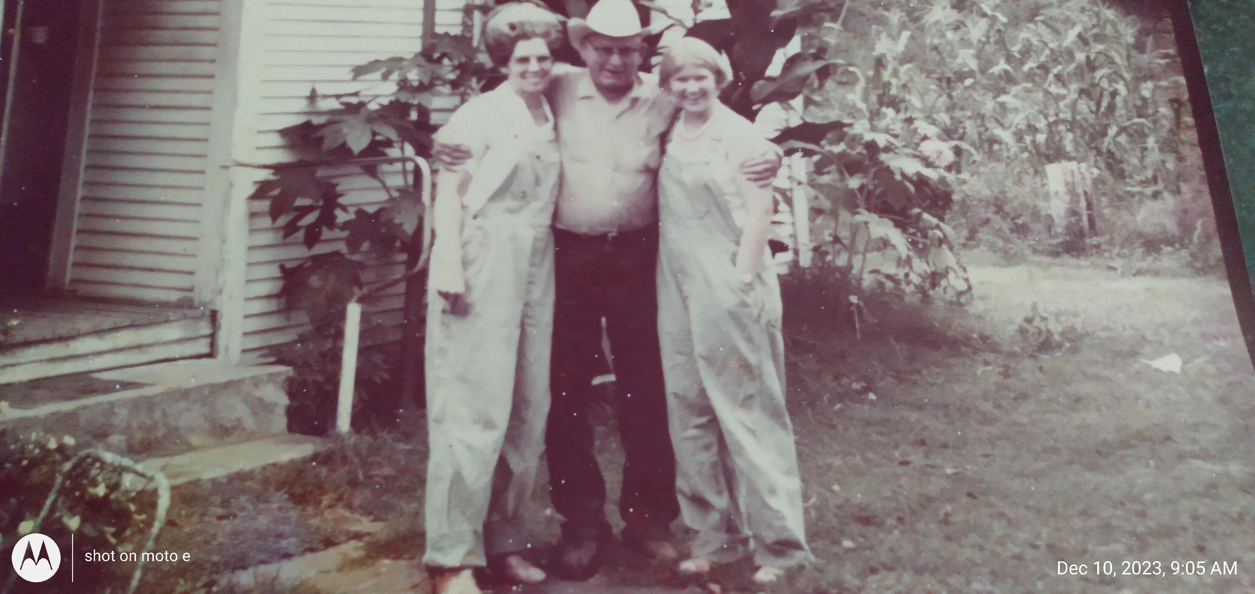 This picture was taken in the summer before Papa died. Mom (Lavern) and I were getting ready to pick corn.  We went home and removed the kernels from the corn them fried it and froze it.  Mom showed me how to do it.