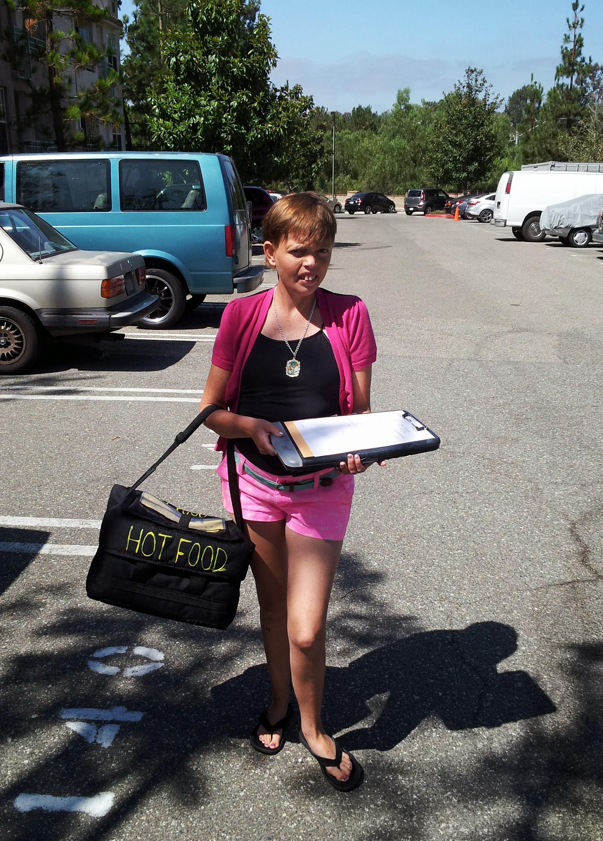 Ashley volunteering for Meals On Wheels. She would say, "People hungry?" "lunch here," and when she gave them their hot meal she would say, "enjoy!"