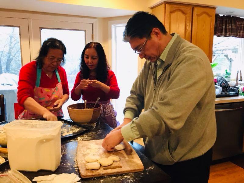 Pastor Bai prepare food for festival. 