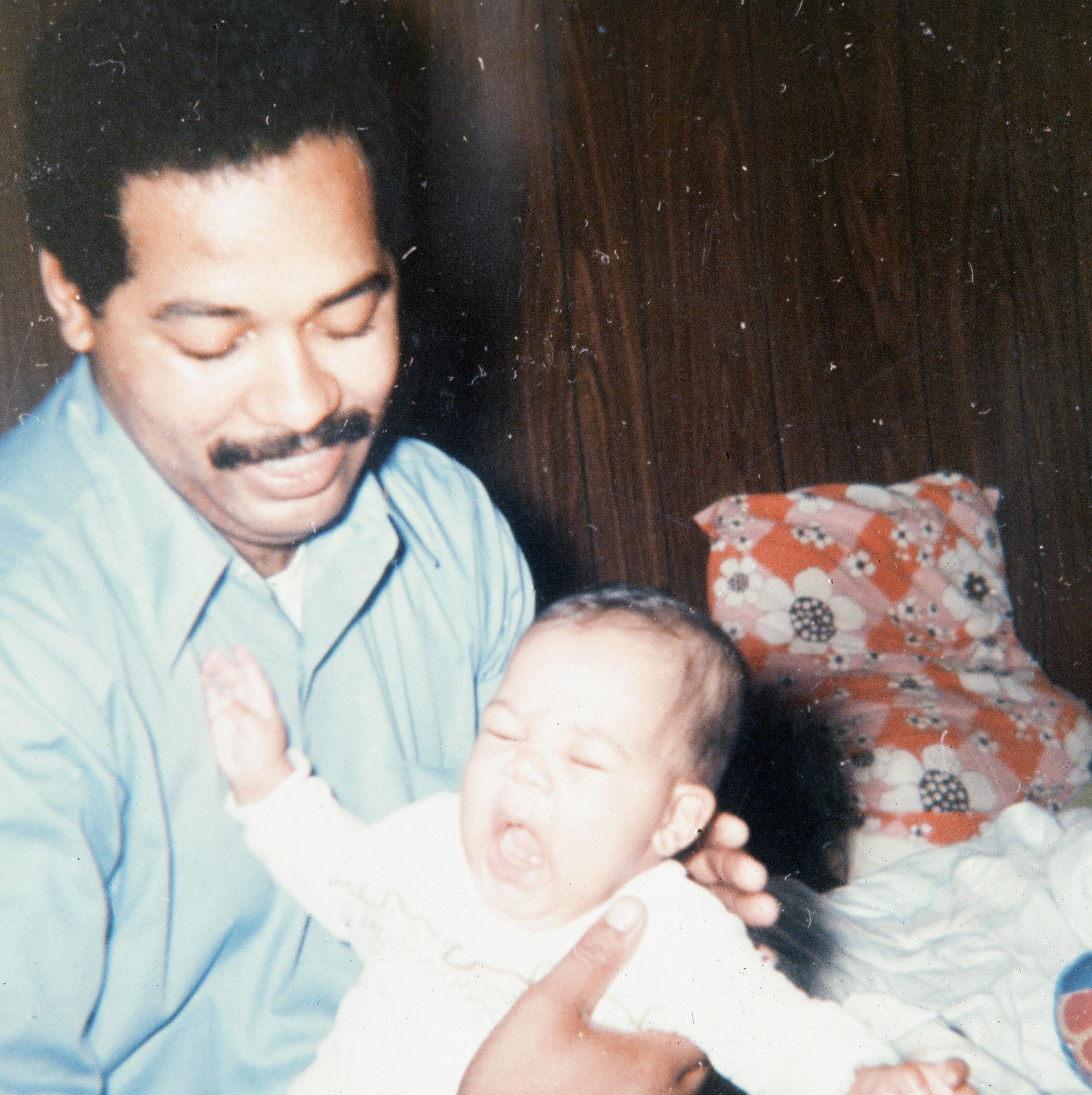 Dad taking care of baby Fela