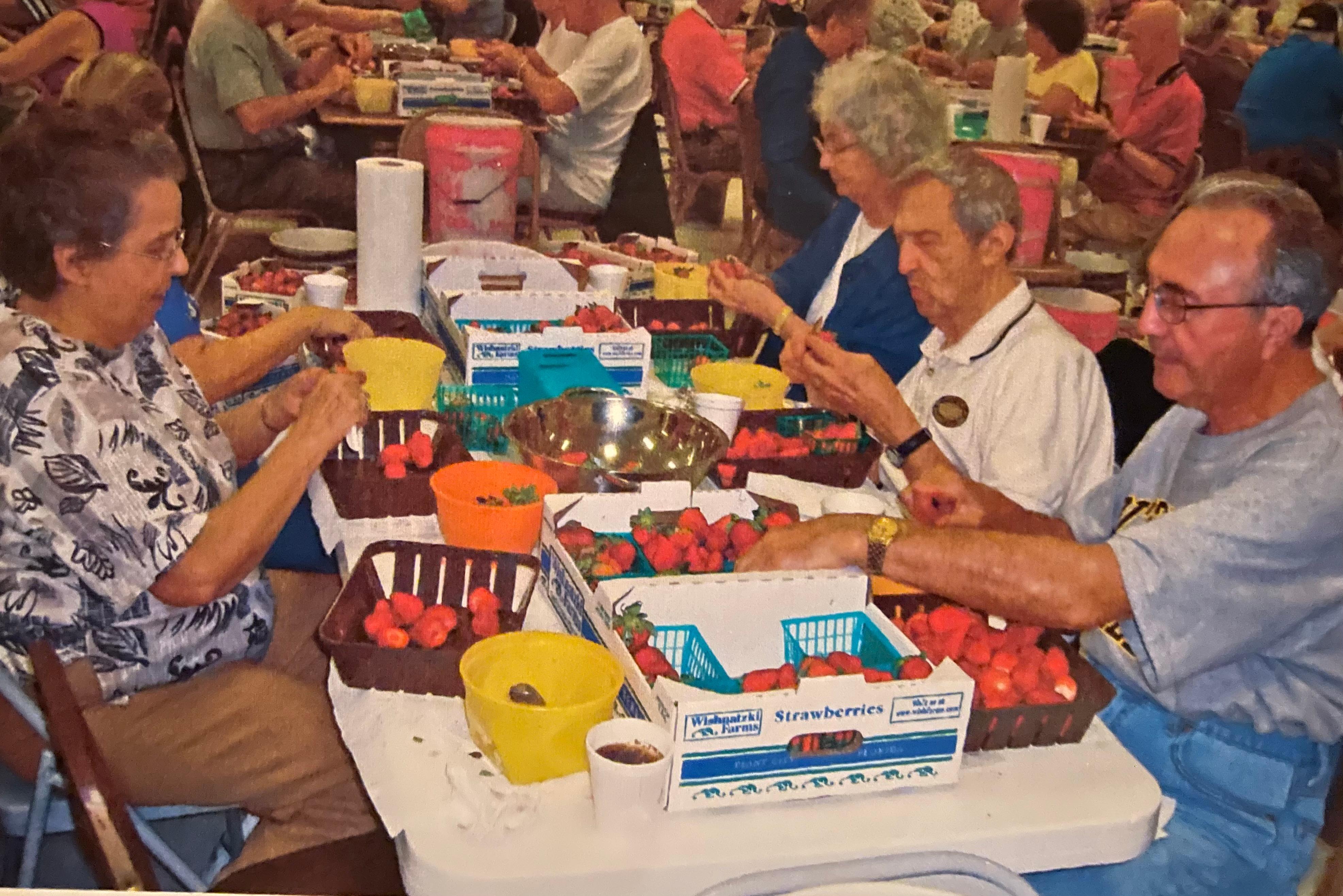 Sam, brother Bill & Esther cleaning strawberries 