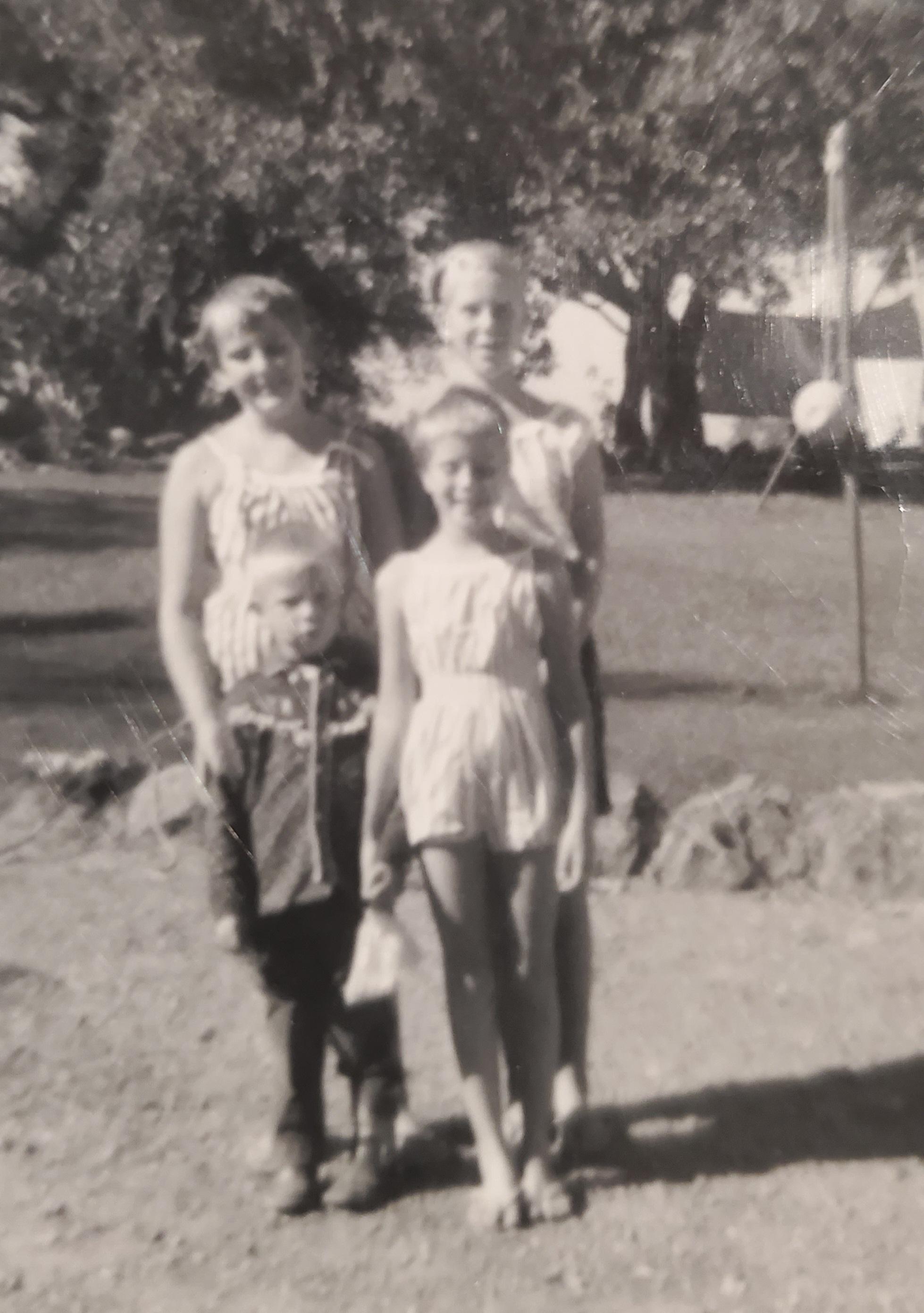 The 4 Eklund kids top left Carole(10), top right is Sandy(12), bottom left Erik(5) and bottom right is Lora(8). Ages are my best guess.