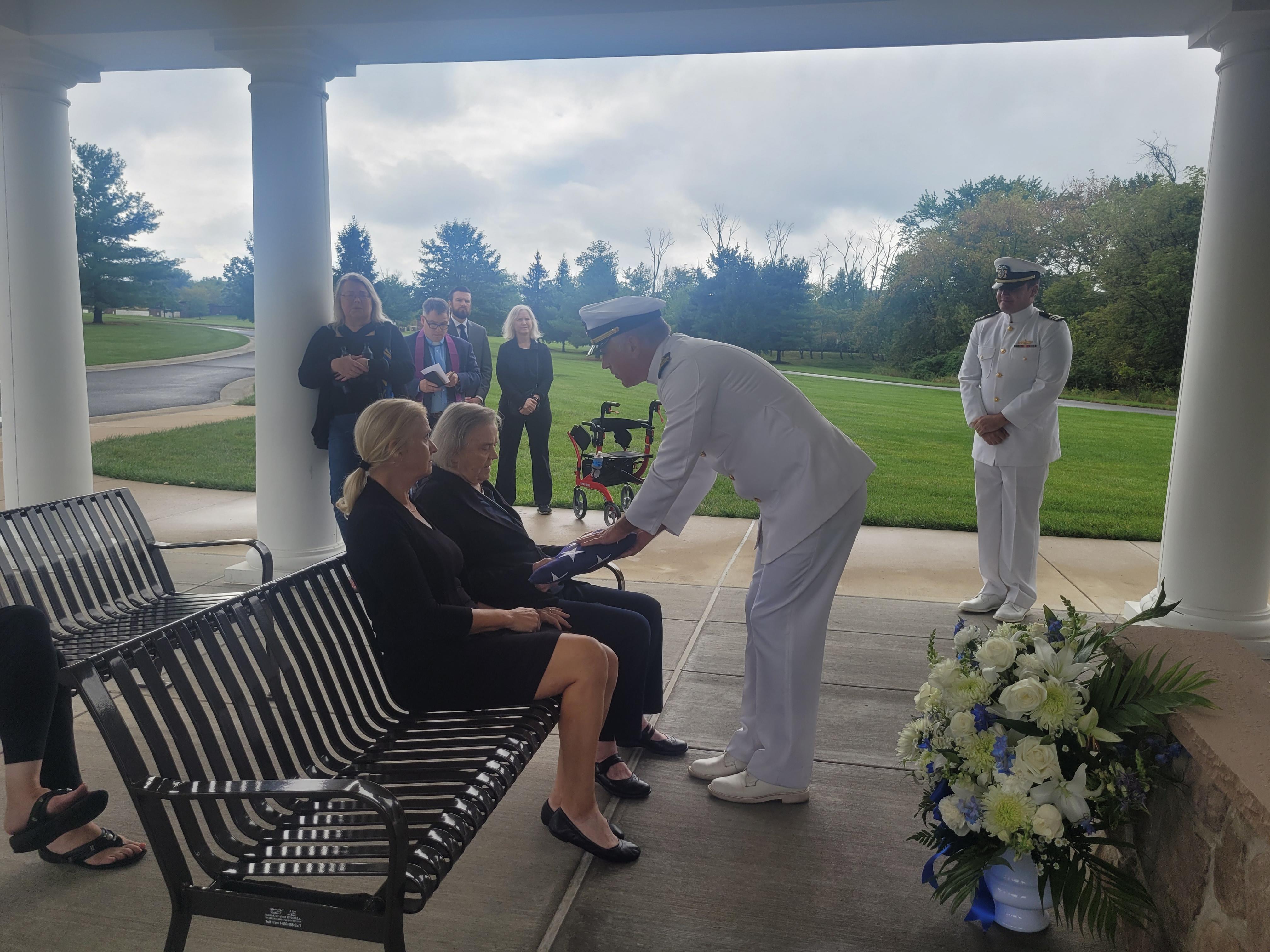 Grace accepting Lyman's flag for his service to our country