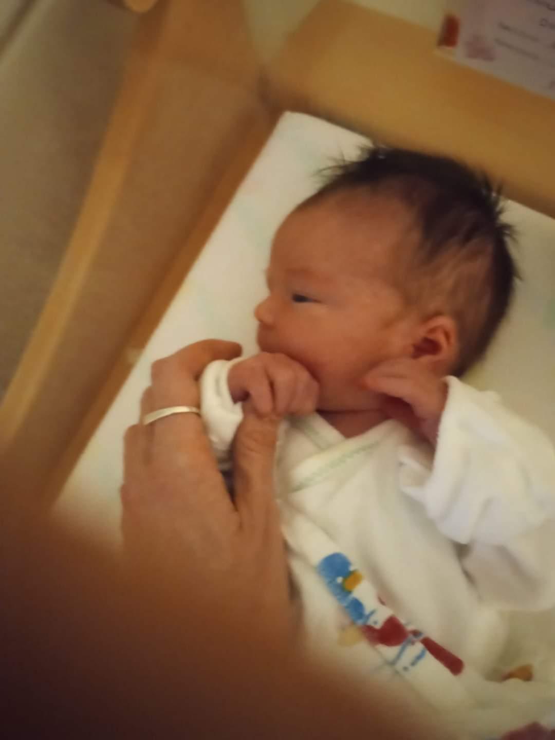 Lynz holding Anneliese's hand