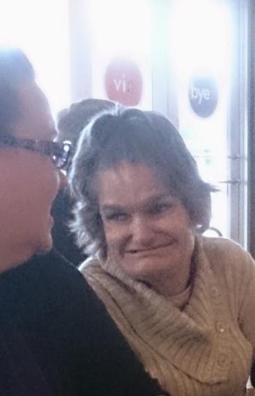 Lauren and Sandy laughing and talking with each other. At the egg and I restaurant.