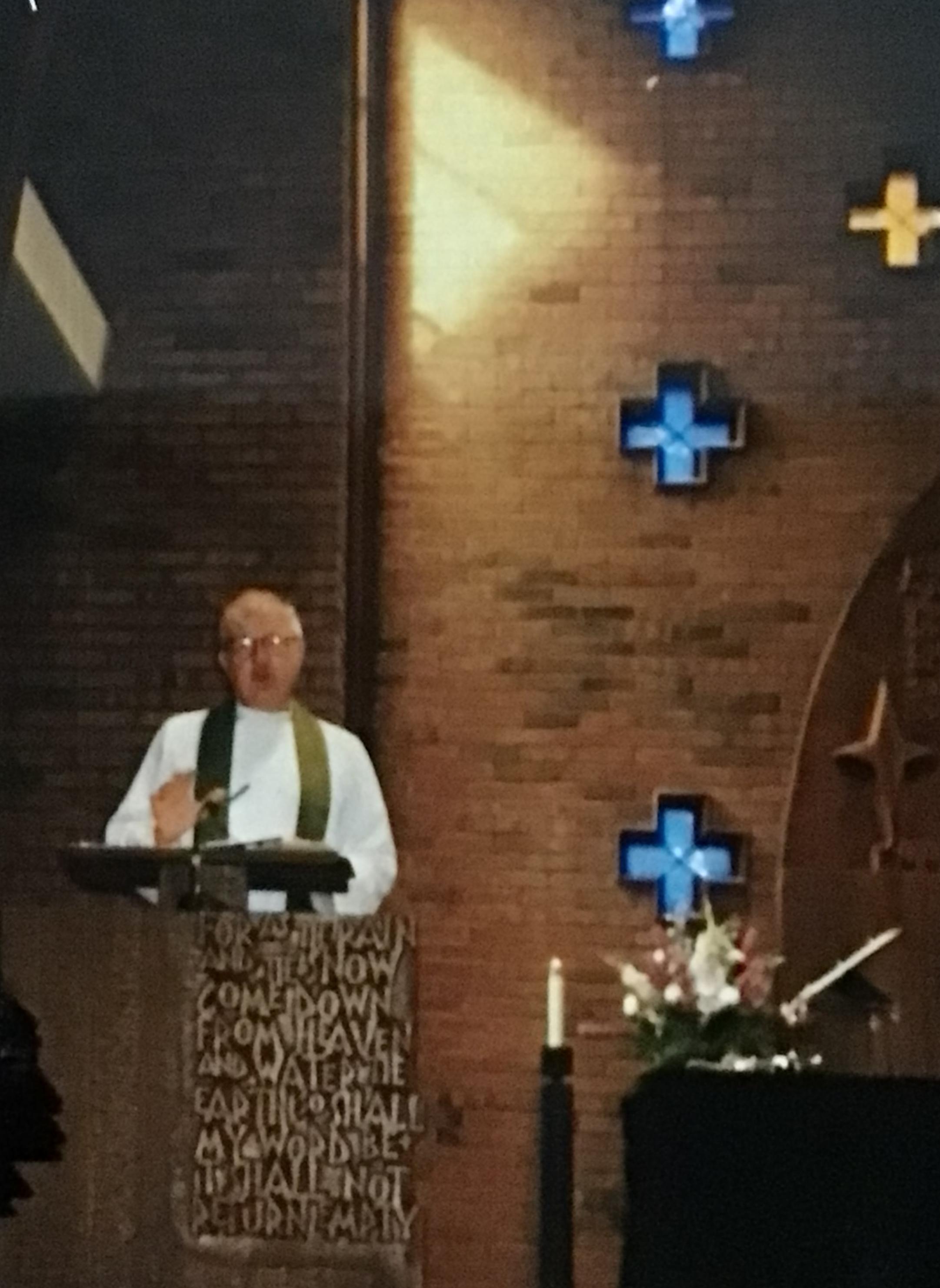 Pastor Lundeen giving a moving sermon in the pulpit.