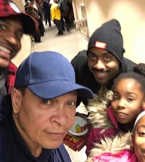 Gene Neal @ UDM basketball game with family💯❤️