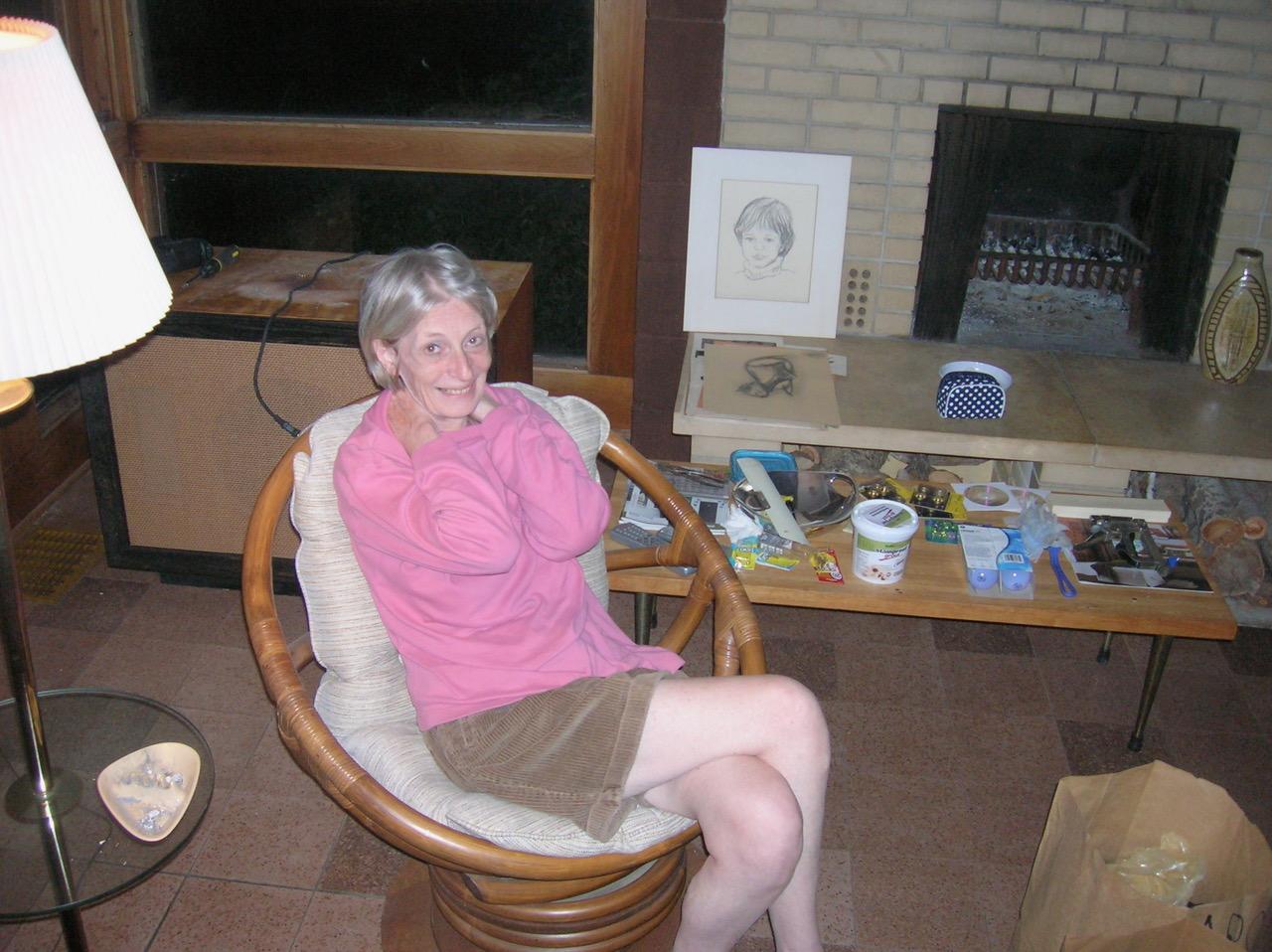 Marsha at the family home in Eden Prarie. Sketch of Kelcey by the fireplace.