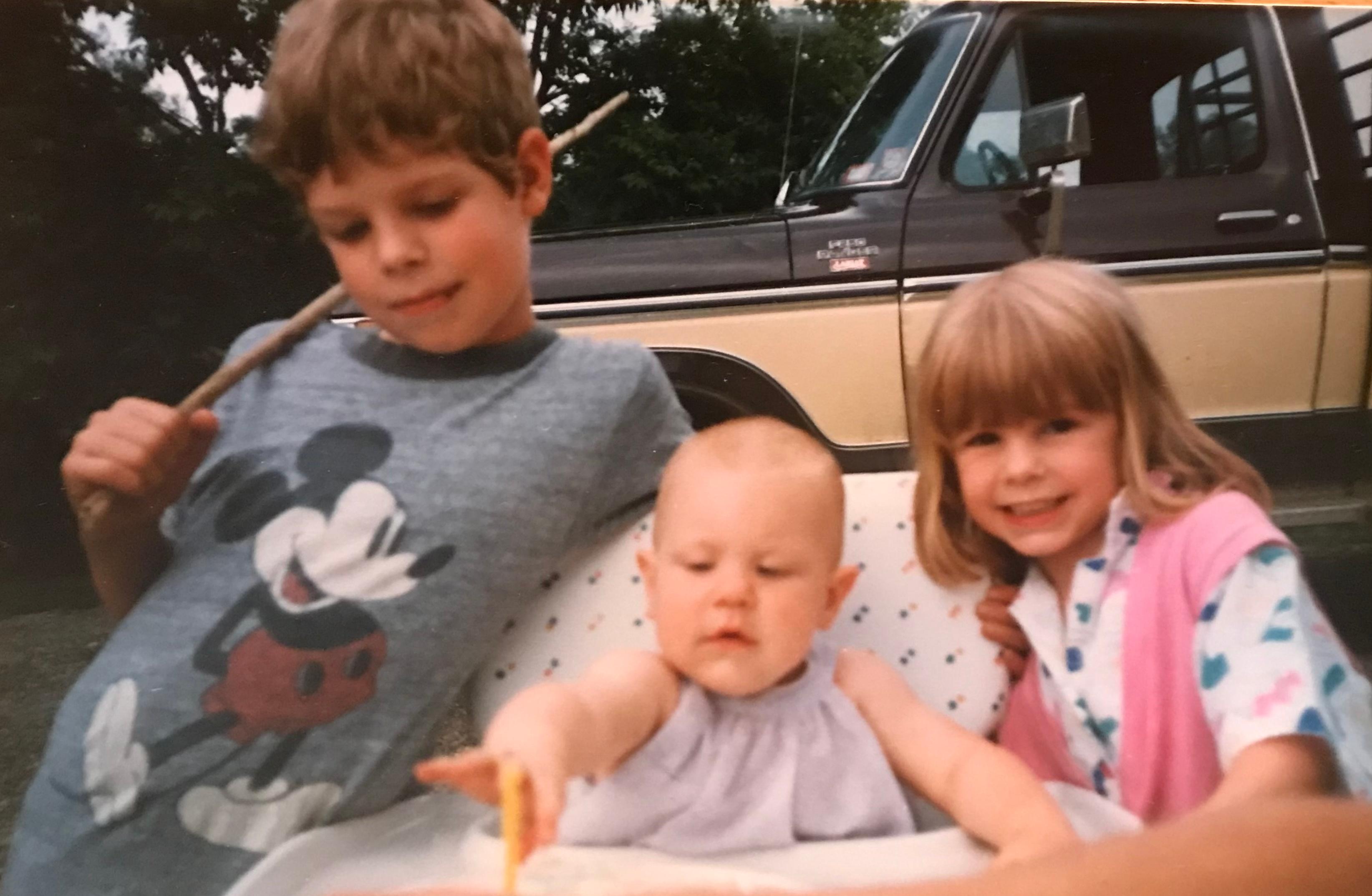 This is the speech that was written and read at Jesse’s memorial service by his sisters Kate Webber & Abigail Penfold;
ABBY:
Thank you all for coming to say farewell but more importantly to celebrate the life of our brother, Jesse Jason Penfold. He was a son, a brother to us, a friend to many, an uncle, a husband to Sarah and eventually became a proud father to Alora and Josie. We were fortunate enough to experience these transitions in his life and be influenced by him throughout our own lives because of course we always looked up to, and protected our big brother, Jesse. Today we would like to share some memories and stories about him from our childhood and paint you the picture of who he really was.
KATE:
Those of you who knew him, knew that he was a true Penfold in the way that he loved anything & everything that had a motor in it! I remember sitting with Jesse at the Lego table spending hours building, as he would run back and forth to the window every time he heard a loud truck passing by the house on 240. He loved riding on my dads tractors and heavy equipment, spending lots of time up at the shop tinkering and learning. He had a real passion for hard work, taking on many labor jobs and later operating heavy equipment in local 17, digging in the dirt that he loved!
ABBY:
Jesse had many nicknames, “Jesse-Duke or DUKE!”, being the most memorable, given to him by his friends after the character, Uncle Jesse Duke from the old Dukes of Hazard tv show. We used to watch him race cars with his friends at Freedom and Holland Speedway, and I remember crossing my fingers for good luck, hoping for a win.
As a family we learned to ski together at Tamarack and when Jesse got older he worked down the road at the big time resort, Kissing Bridge making snow. He knew I was already very interested in snowboarding so instead of using the season pass for himself he signed it over to me, what a great big brother!
That’s who he was, he was a giving, caring person who loved to make others laugh and had a contagious laugh himself. He was seven years older than me so the punchline of many jokes often went over my head but that didn’t matter, I would just wait for Jesses characteristic laugh, cueing me to crack up.
KATE:
His laugh, was so memorable, how could anyone forget that! Almost every heartfelt comment that I have read online mentions it. I had gotten so used to his explosive laugh lighting up a room, I imagined that everyone must have a family member like this but that was his special trait! He was a story teller, an entertainer, loved to socialize and he would be overjoyed to see everyone here today.
Jesse could make the most boring of stories come to life, with his impersonations, sound effects and exaggerated expressions. He would often entertain us by making up songs and basically singing at my sister and I, while we were “supposed” to be concentrating and doing homework.
ABBY:
I would often barge into his room and he would let me stay and listen to his wide array of music, play video games and hang out with him and his friends, even though I was his kid sister. He was always looking out for his younger siblings, cousins, friends you name it and was great with kids as he was a big kid himself! Jesse was a gentle giant, he was a nurturer, loved to garden and had quite the green thumb similar to our mom and relatives on the Michels side. We always thought in another life he might have been a farmer like our ancestors. It is very fitting that he made his home in the countryside with Sarah where he could have a large garden, tend to the land and live a version of the farm life he always identified with.
KATE:
As our uncle Russ Michels wrote, “Jesse did lots of good for people around him and people whose path he crossed daily, weekly, and monthly- whether they asked for help or not. He was willing to get up when knocked down and keep moving forward even if it was in a new or uncharted direction, he was truly a Good Citizen of the World.
He loved his family, wife Sarah and his little girls; Alora and Josie and now it is our duty going forward to tell his stories and keep Jesse’s memory alive. Thank you again for being with us here today.