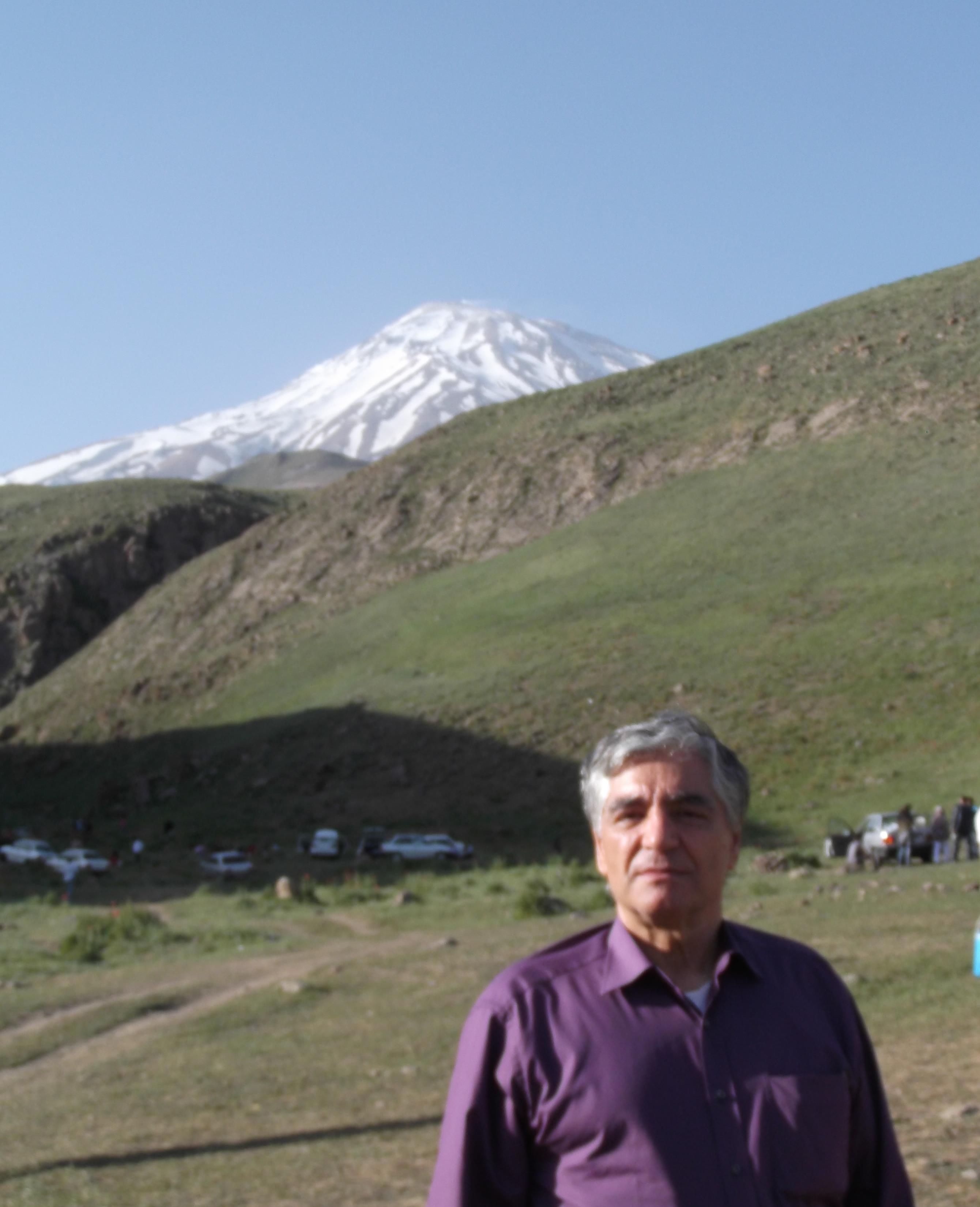 Dr. Bijan Esfandiari with Damavand volcano (northern Iran) in background.