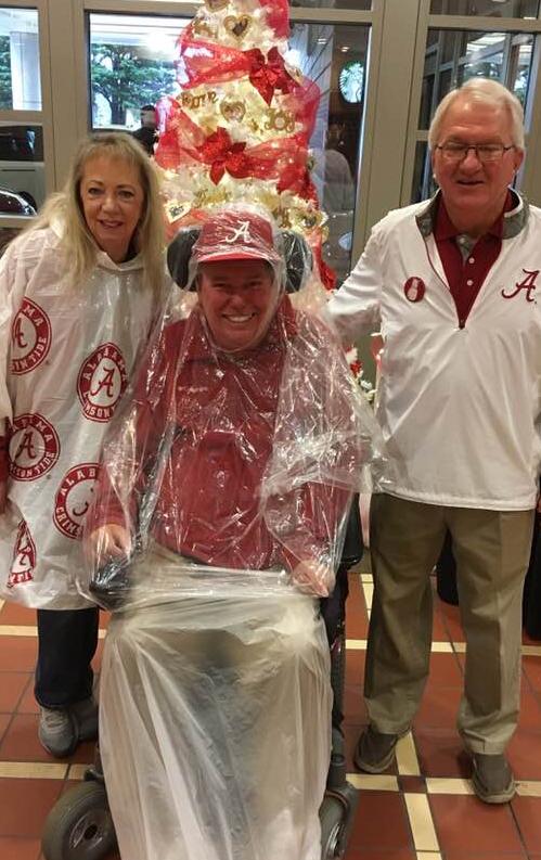Mom and Dad enjoying an Alabama game - some stranger liked their outfit and excitement so much that he asked for a picture with them!