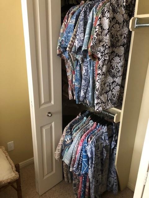 George's collection of Reyn Spooner Hawaiian shirts. Each had a story behind it.
