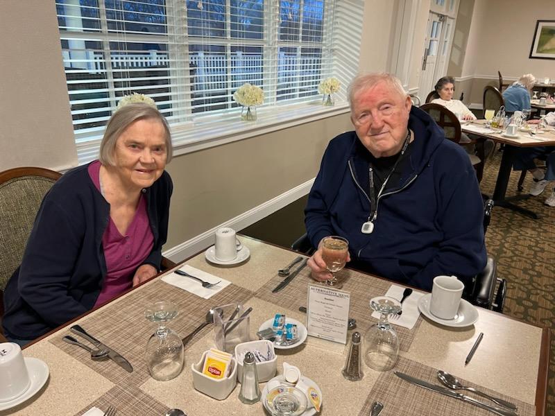 Grace and Lyman sharing a meal together