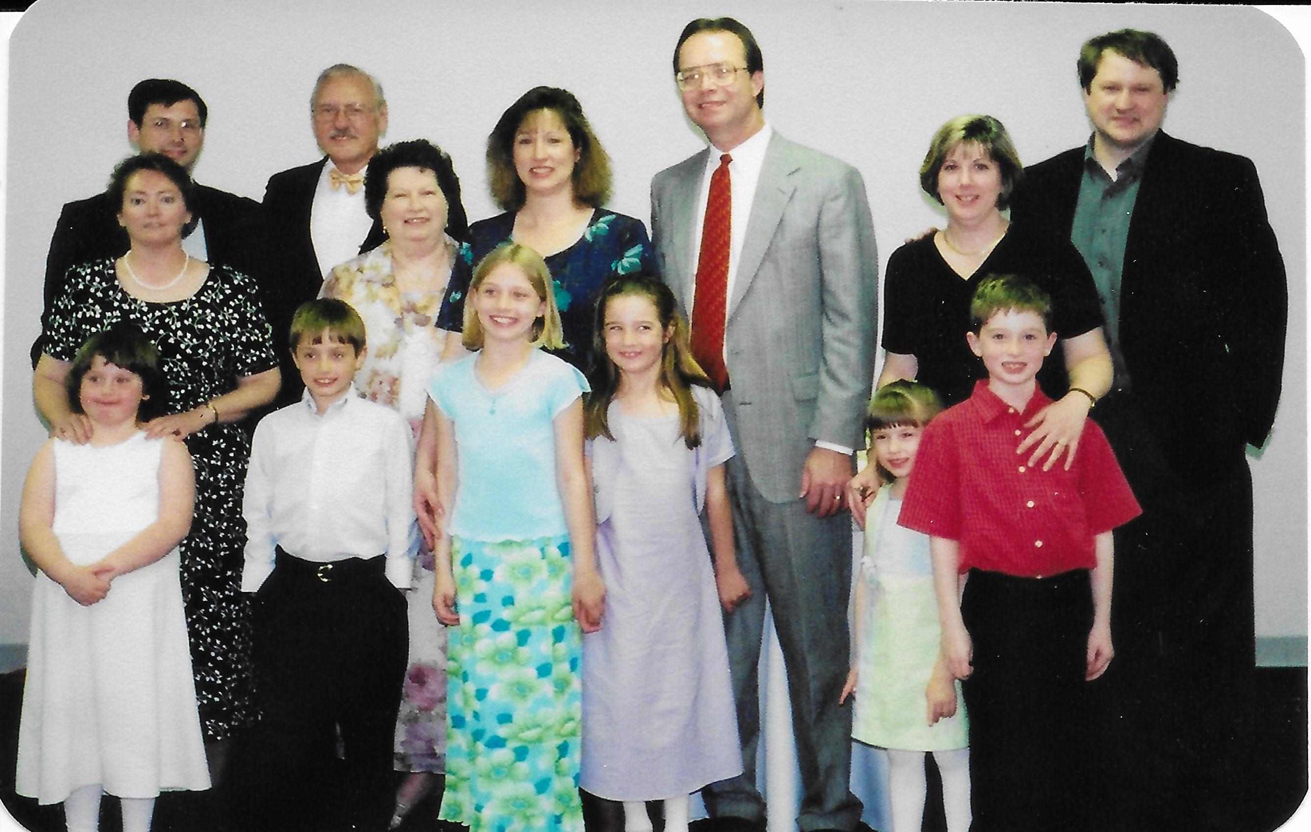 The motley crew from 2002, at Granny & Granddaddy Hutcherson's 50th wedding anniversary celebration in Roanoke.  Notice the hair is starting to calm down - the 80's started finally relinquishing its hold!