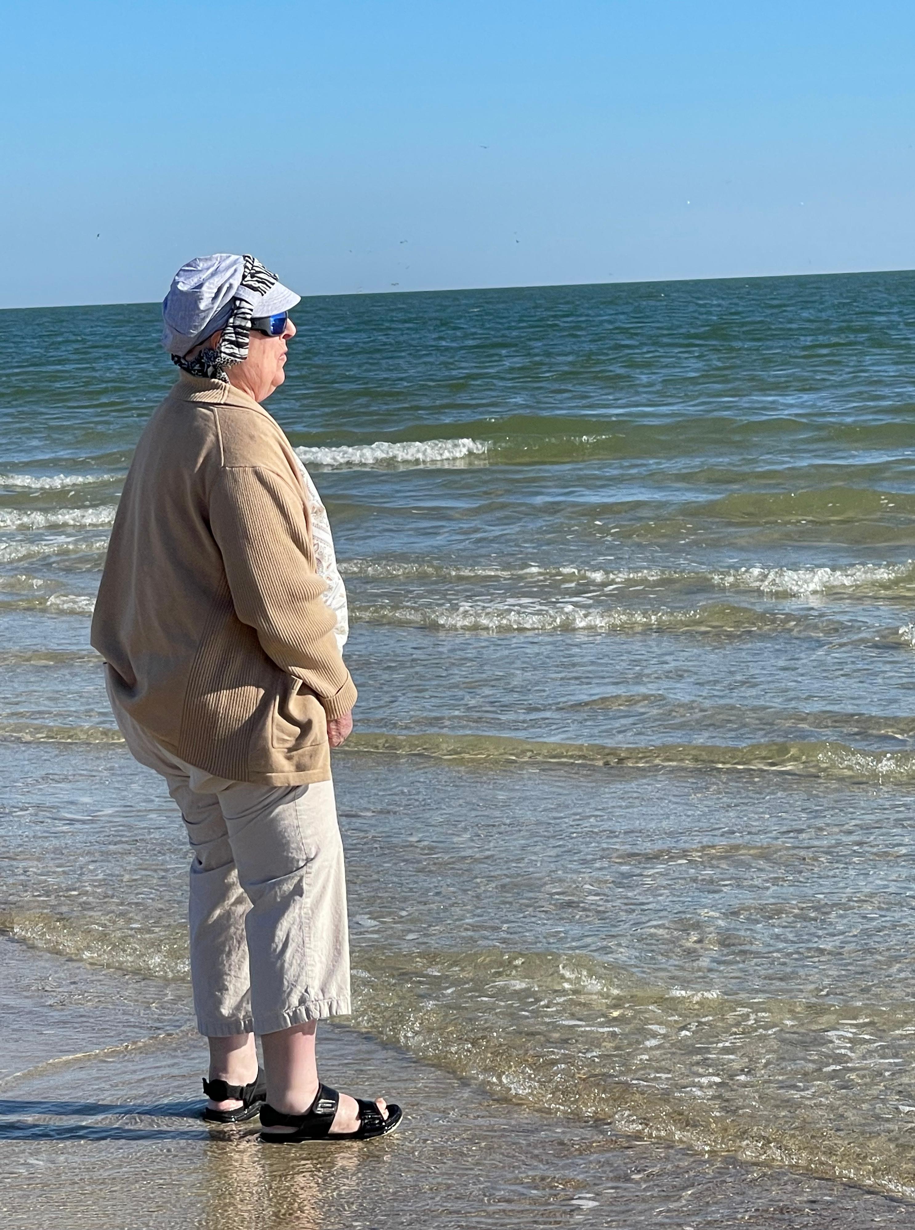 Sharon putting her toes in the sand! Birthday celebration March 2022