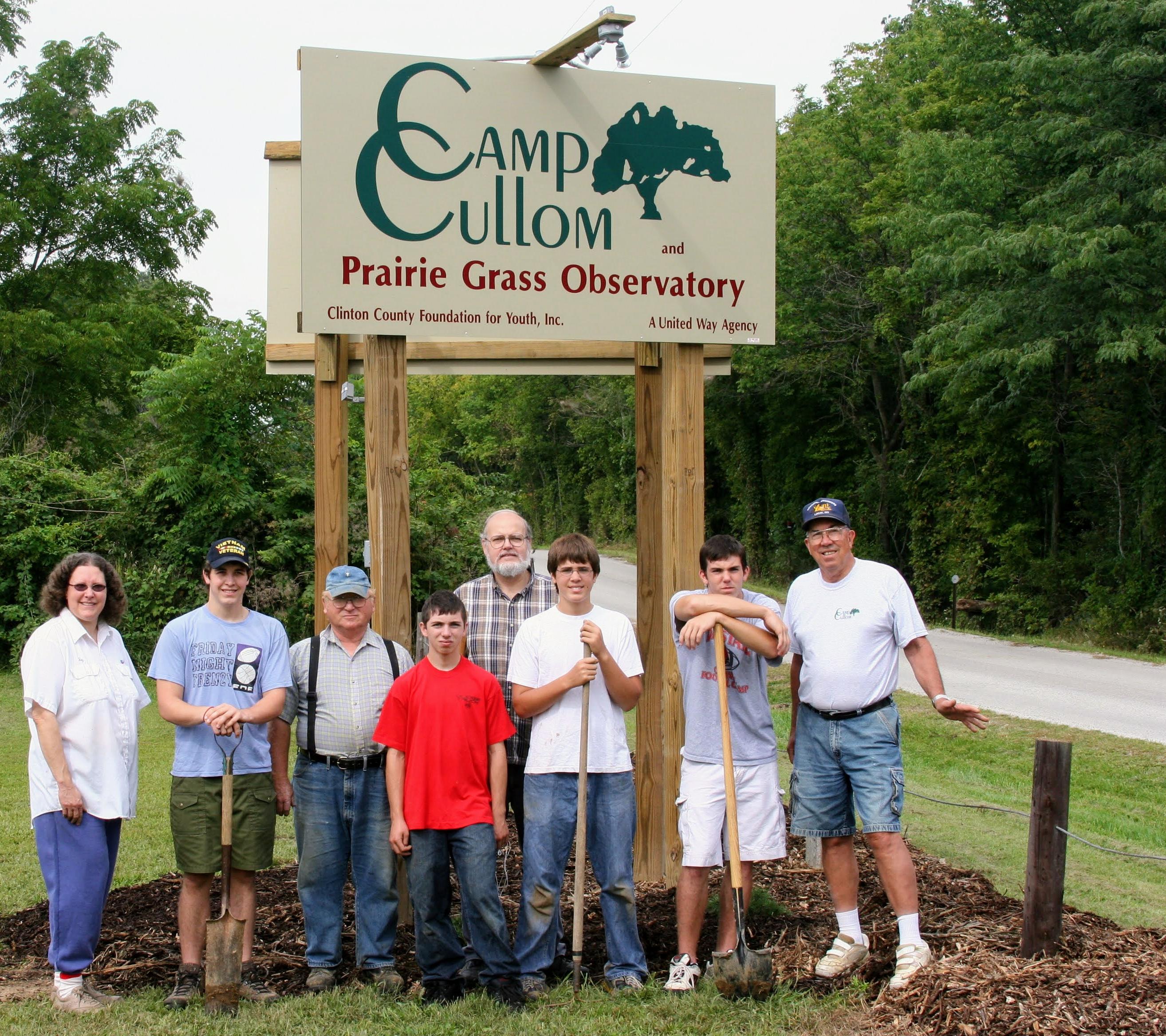 Jerry helping his grandson, Nick Seager, with his Eagle Scout project - putting up the Camp Cullom sign that highlights the Prairie Grass Observatory (July 2006)