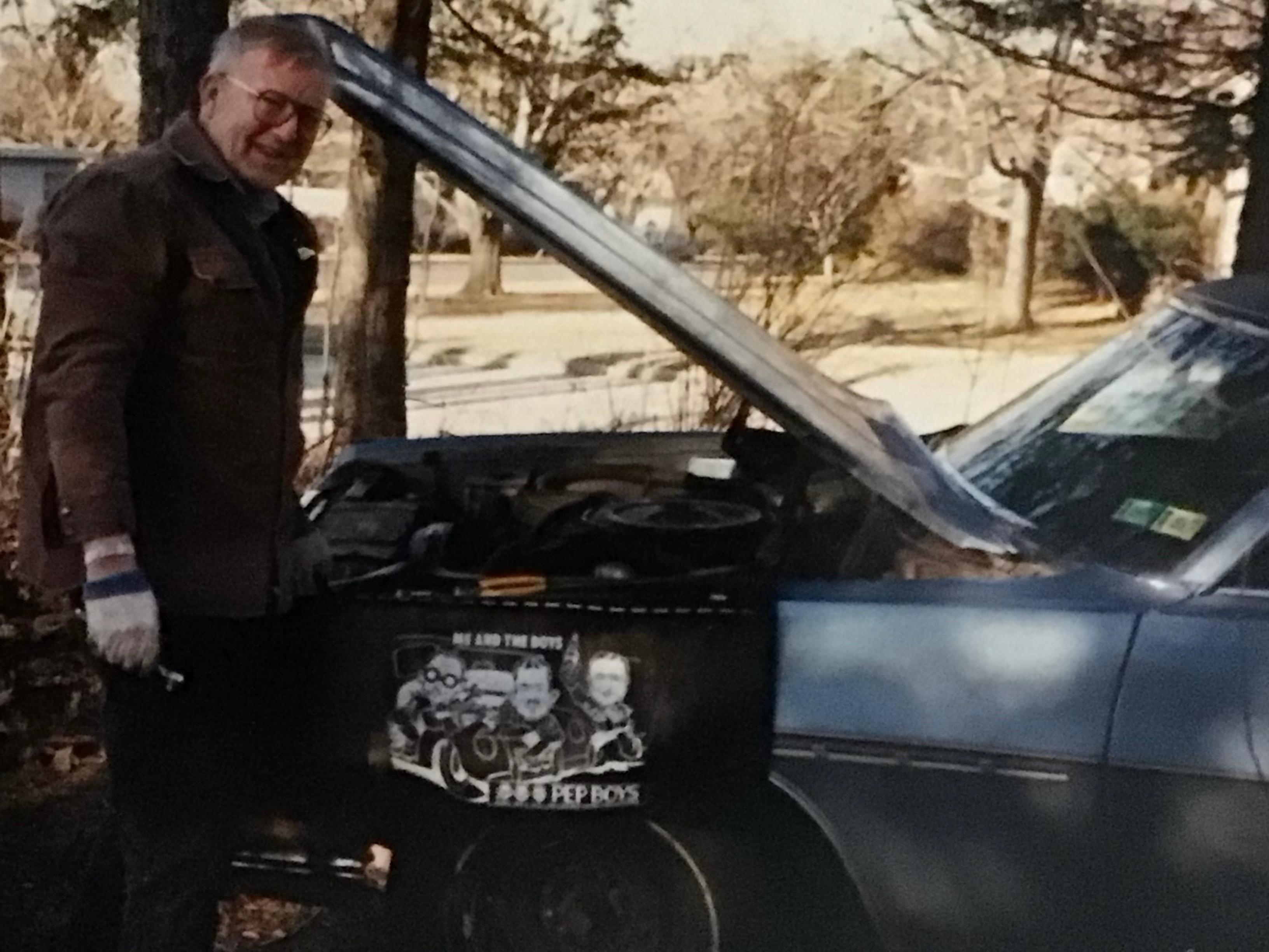Lyman’s brothers were really into repairing cars. Here’s Lyman playing the part.