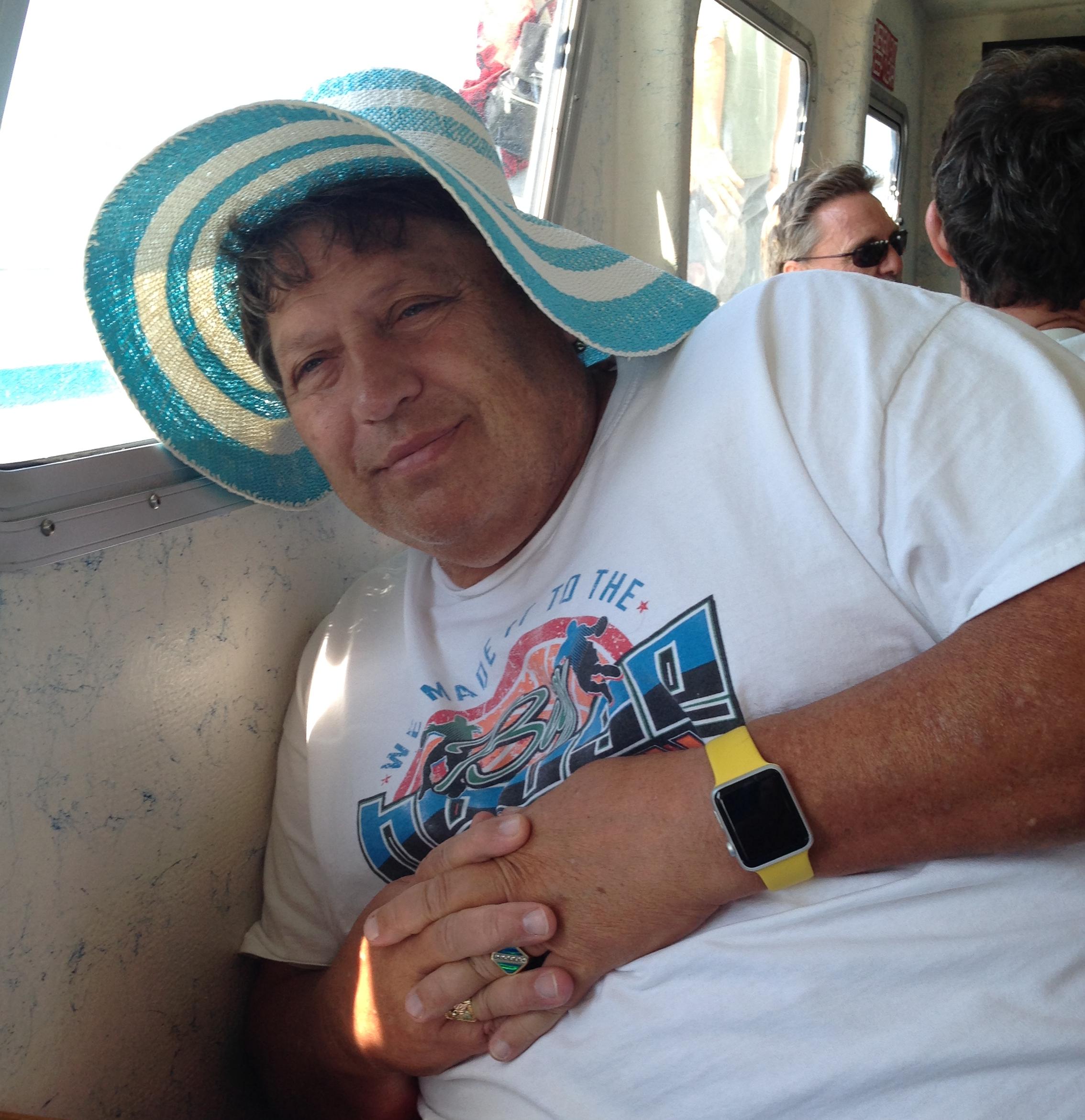 Being a goofball, and wearing my mom's hat during whale watching.